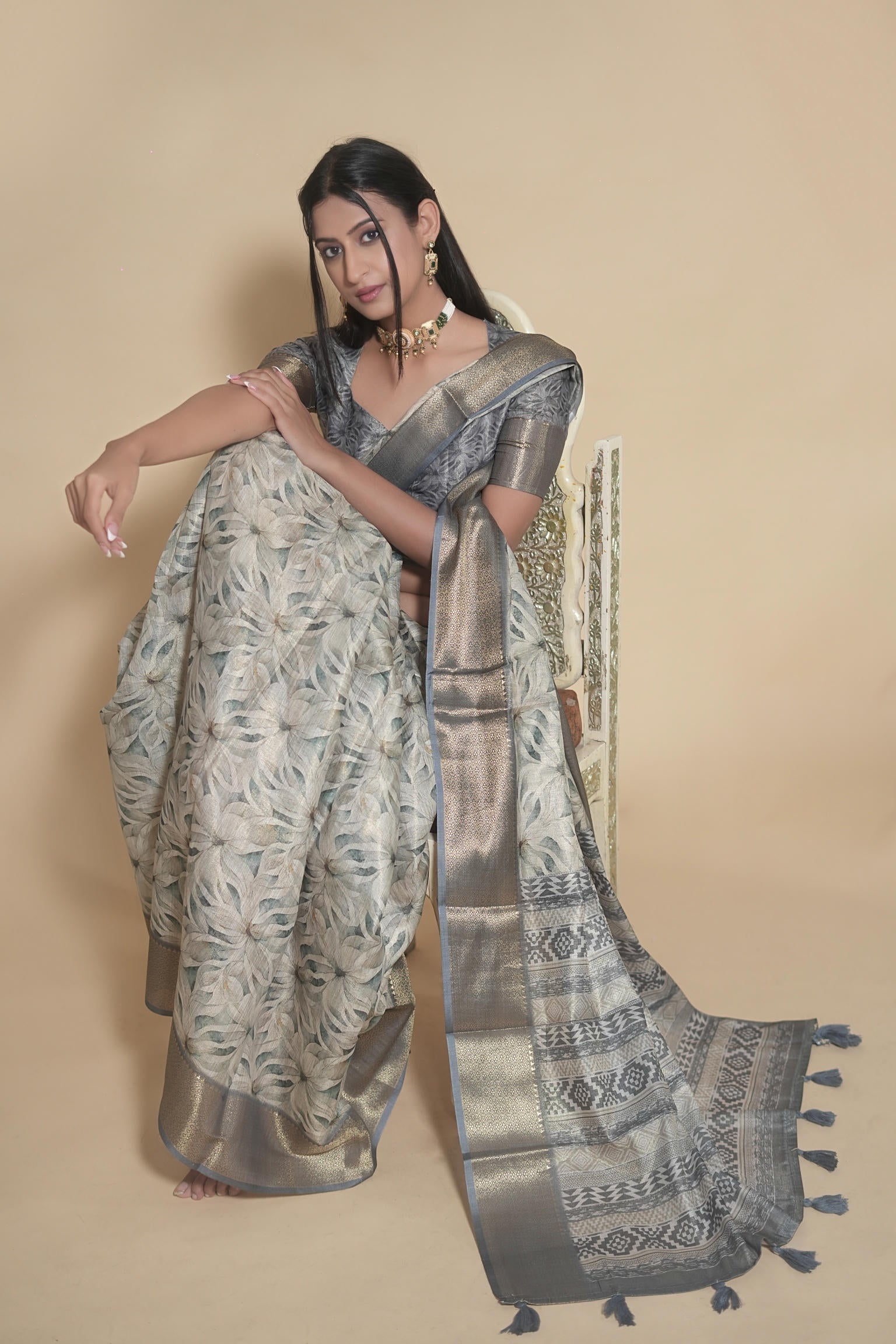 Steel grey and beige floral print saree with dull gold zari border and geometric pallu