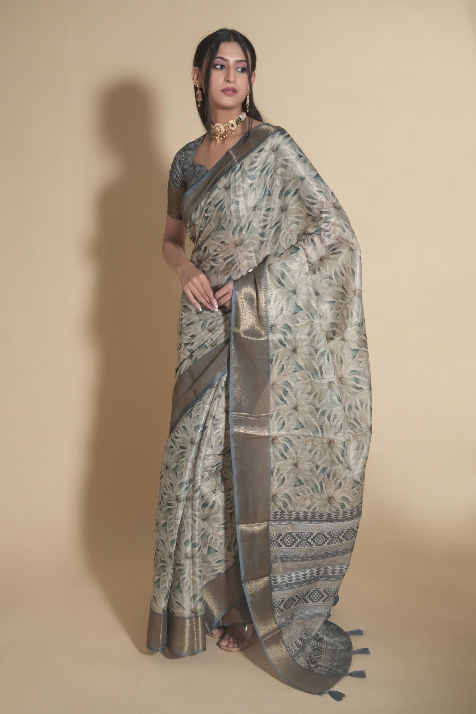 Steel grey and beige floral print saree with dull gold zari border