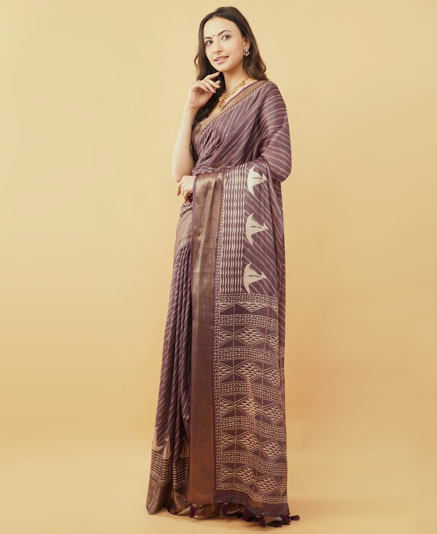 Taupe textured saree with floral Kalamkari panel and zari border
