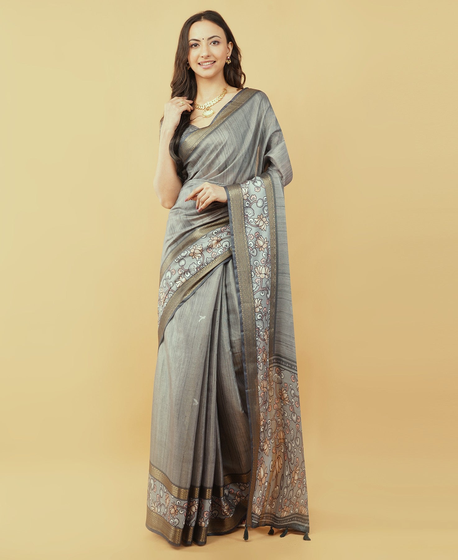 Beige and rust abstract botanical saree with bronze zari border and tassel pallu