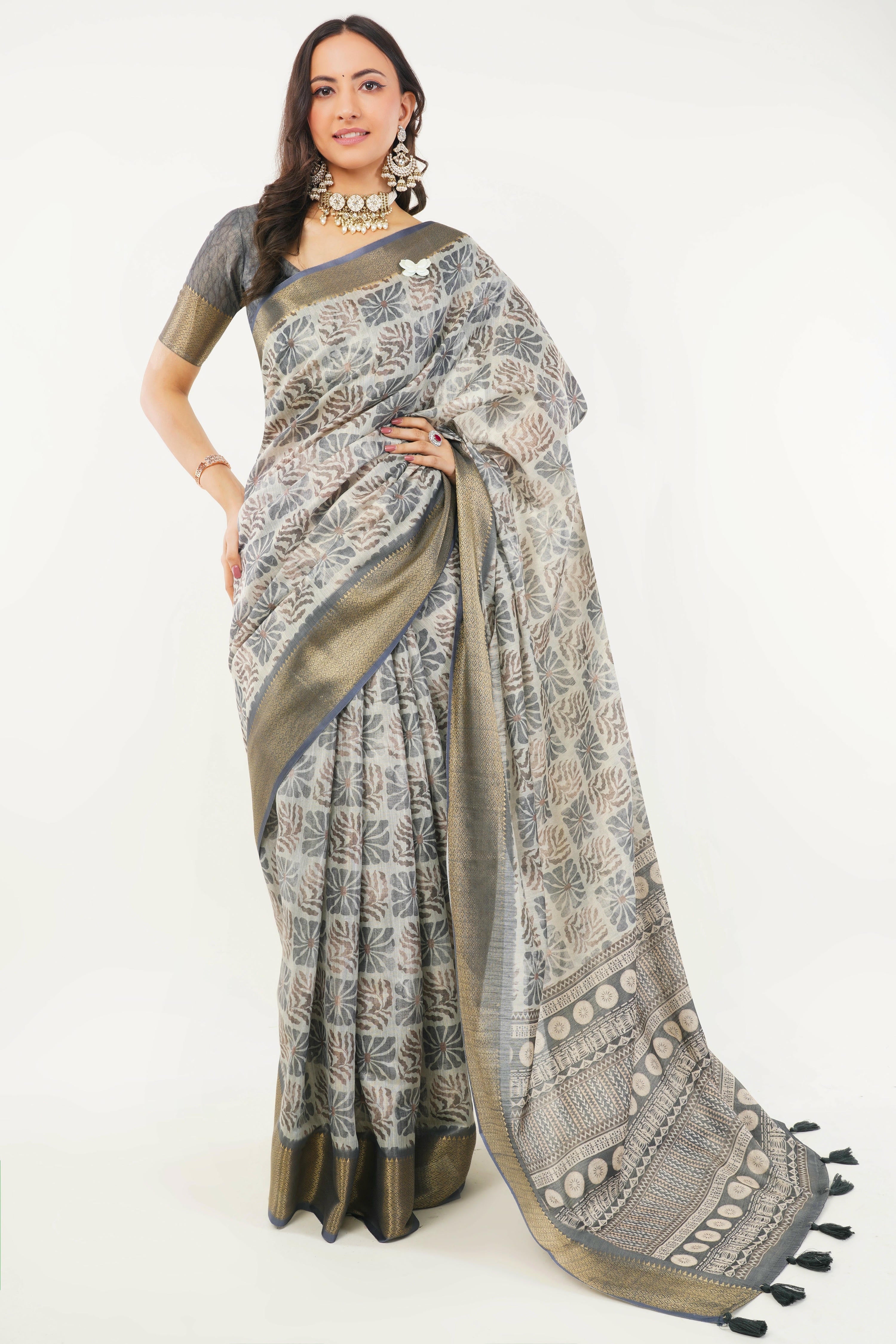 Charcoal grey and off-white abstract print saree with antique zari border and tassel pallu