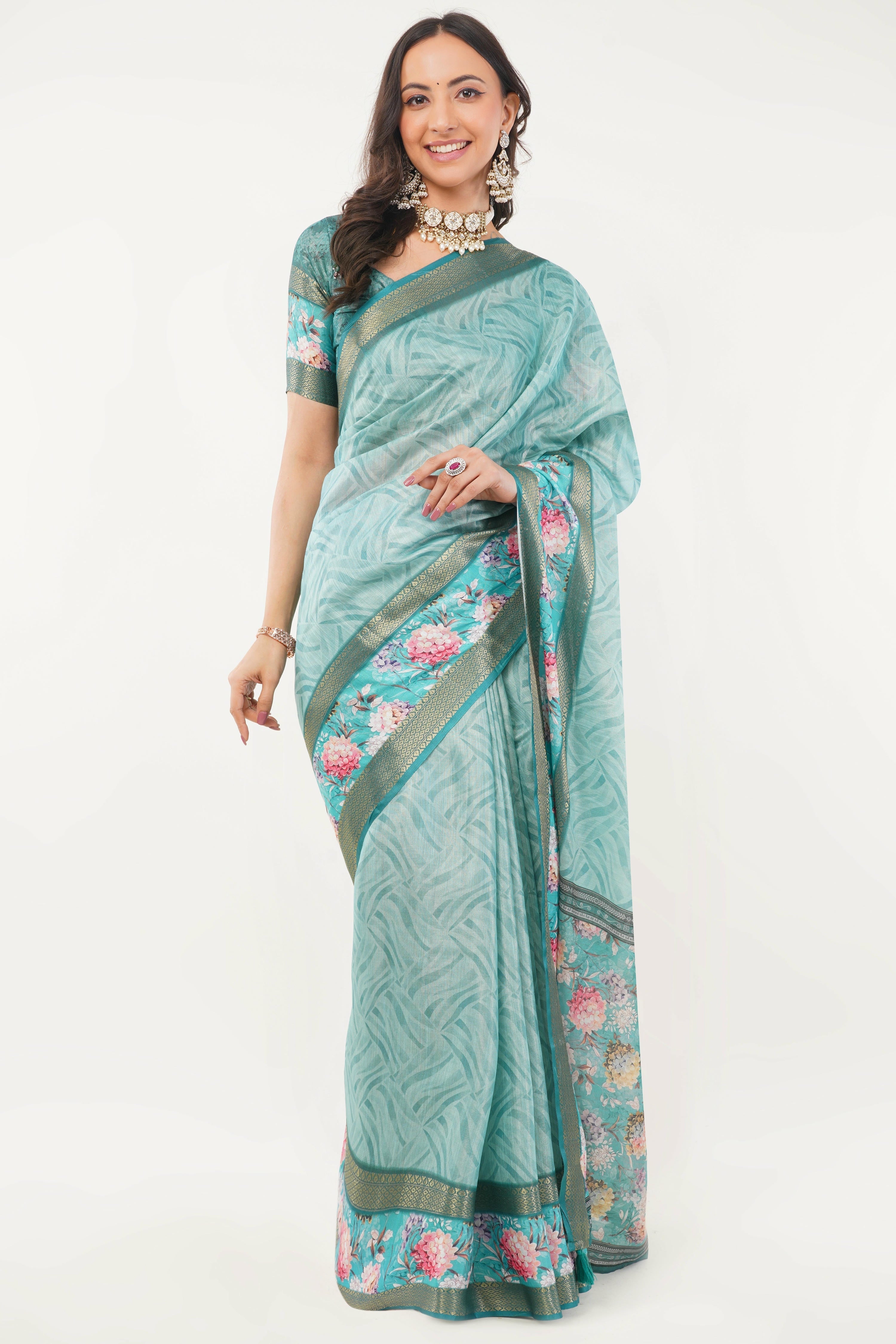 Turquoise blue regular wear saree with tassel detailing and black sleeveless blouse