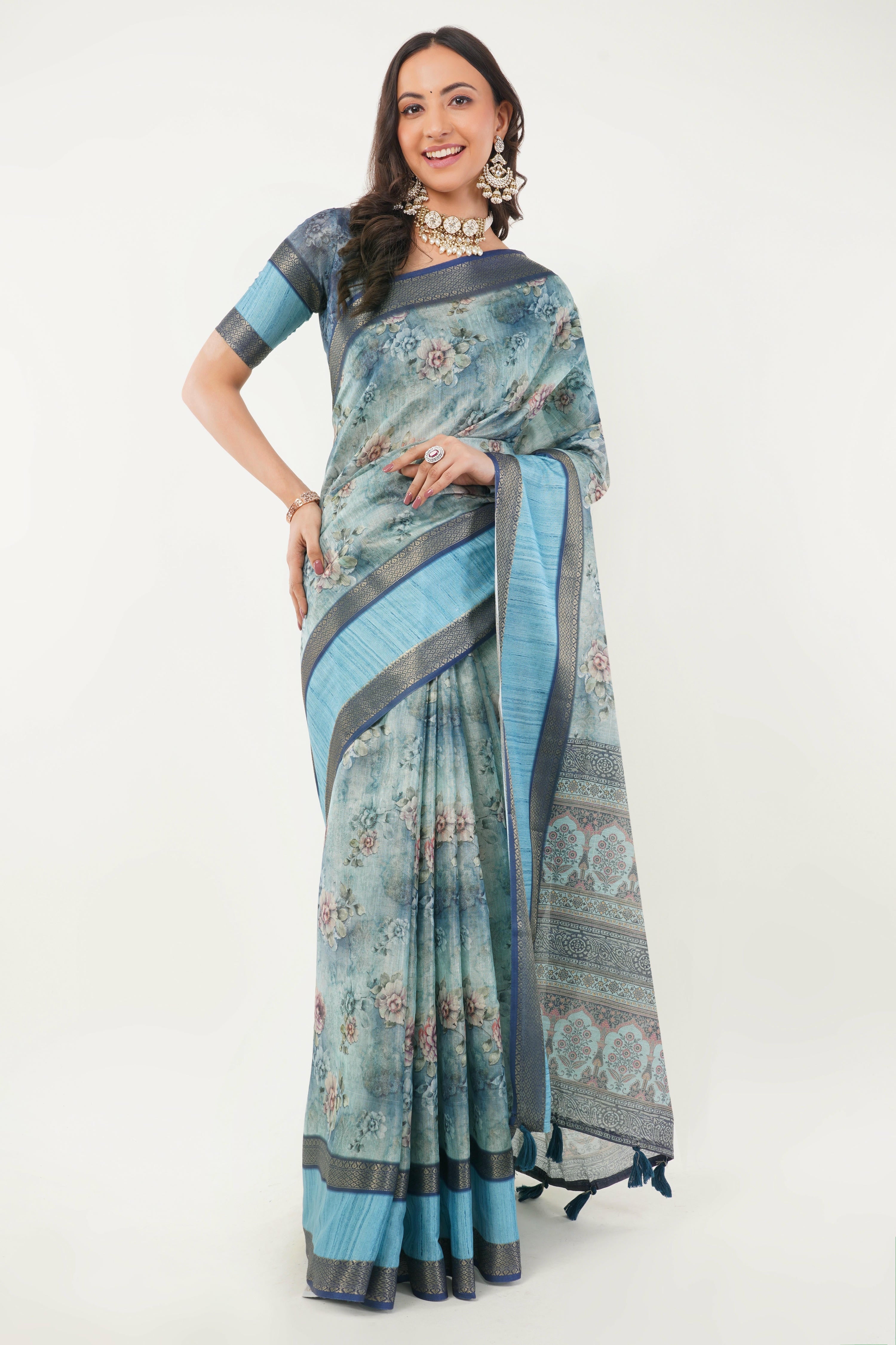 Cerulean blue floral print saree with zari border and tassel pallu