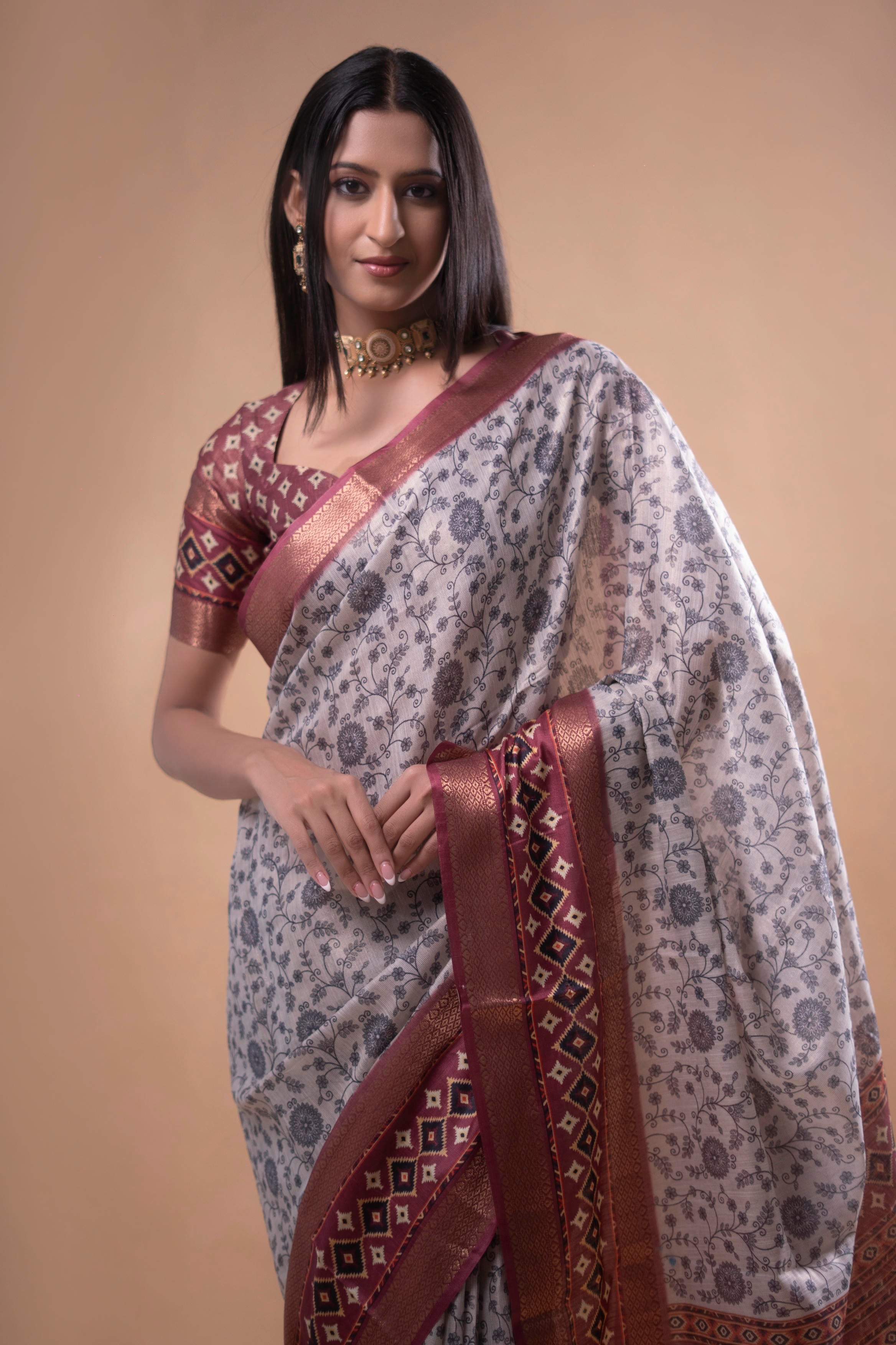 Cream Floral Saree with Maroon Geometric Zari Border and Printed Blouse