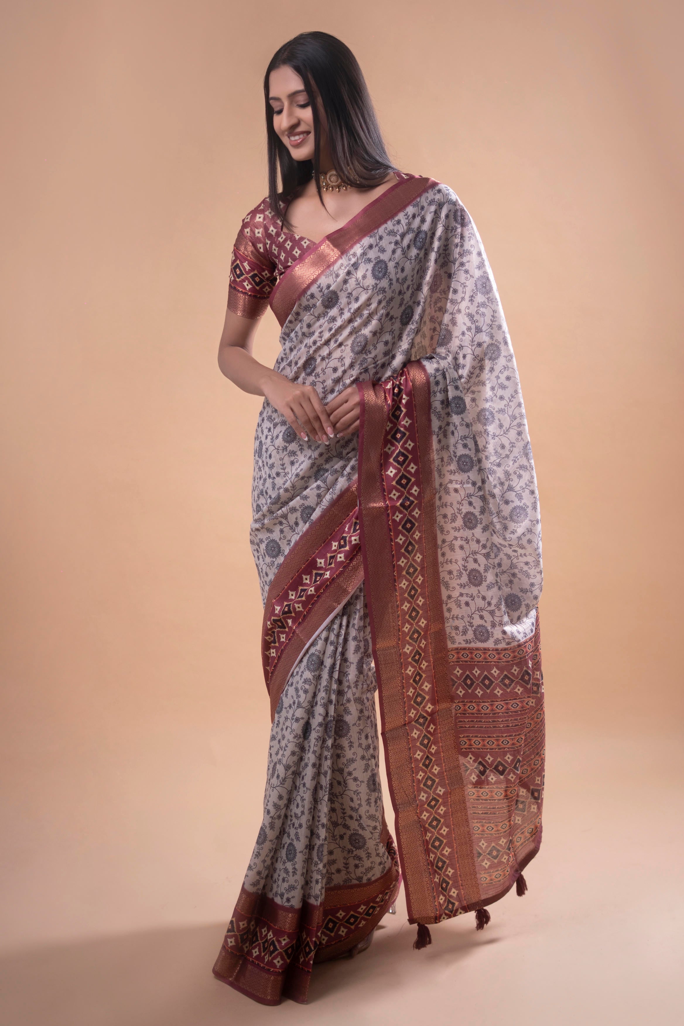 Cream Floral Saree with Maroon Geometric Zari Border and Printed Blouse
