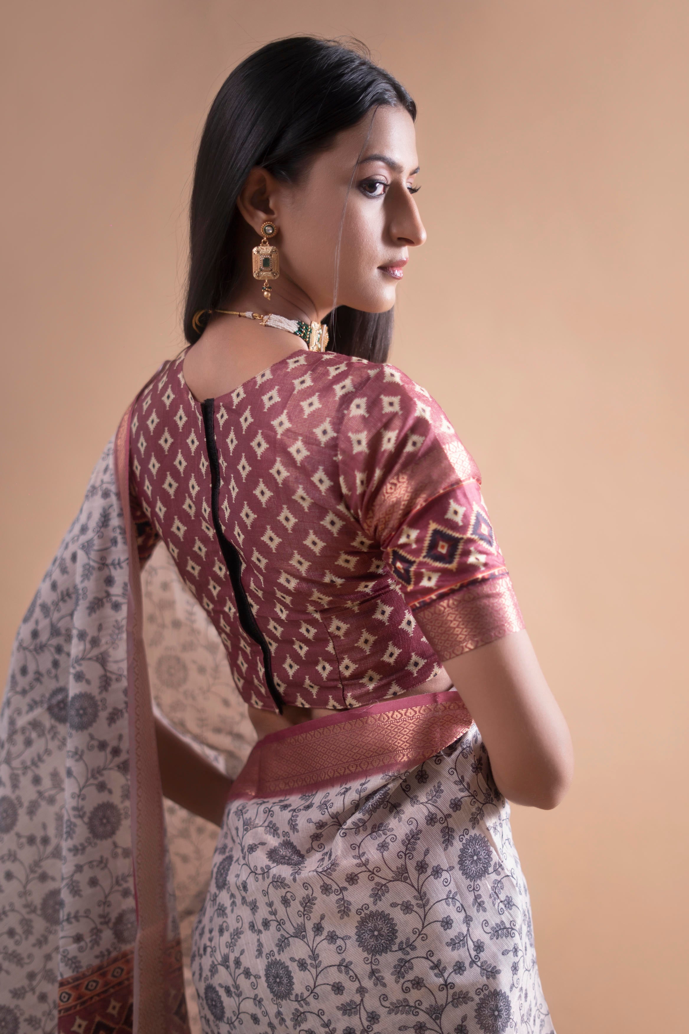 Cream Floral Saree with Maroon Geometric Zari Border and Printed Blouse