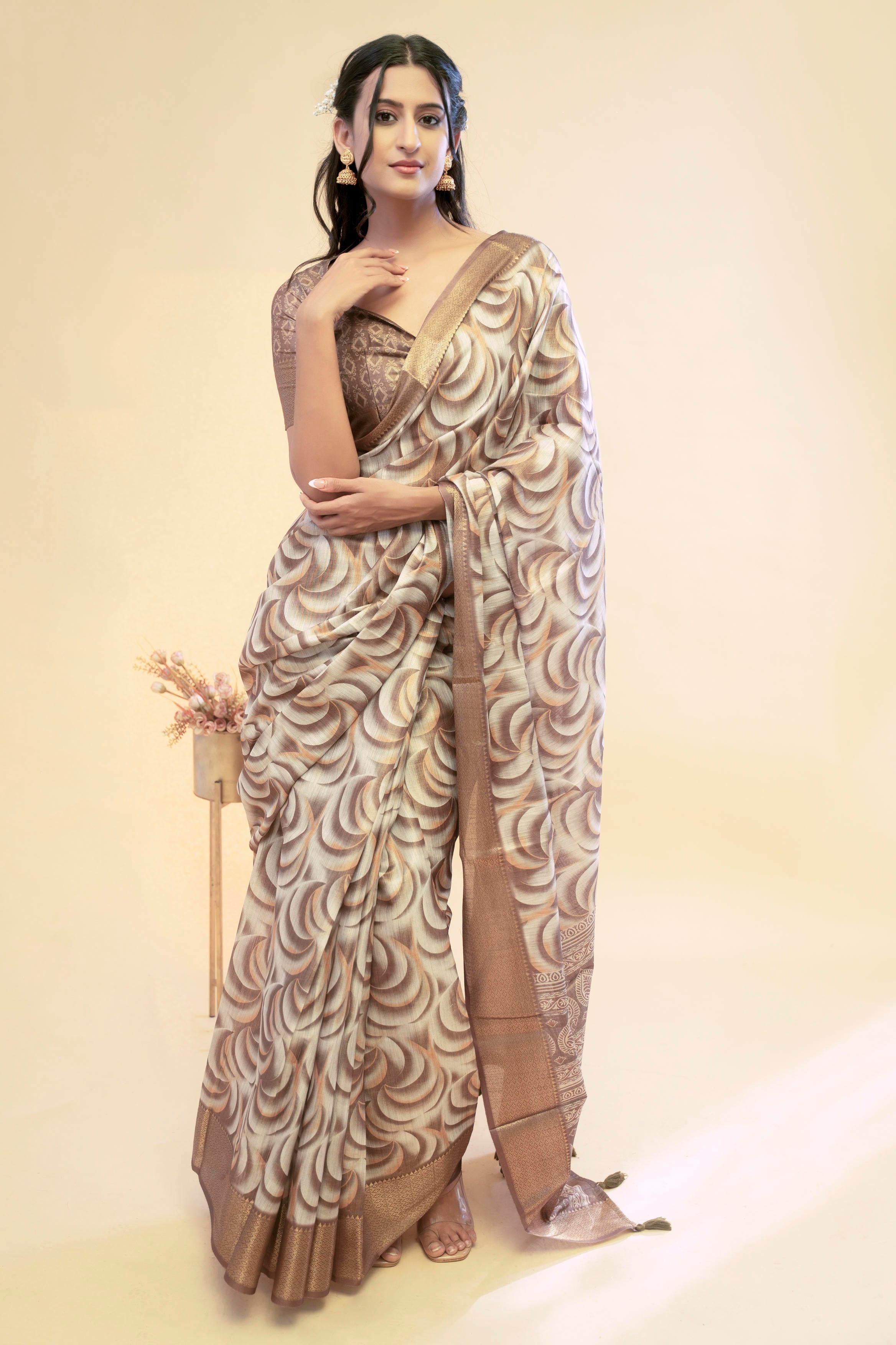 Bronze and cream abstract wave print saree with antique gold zari border