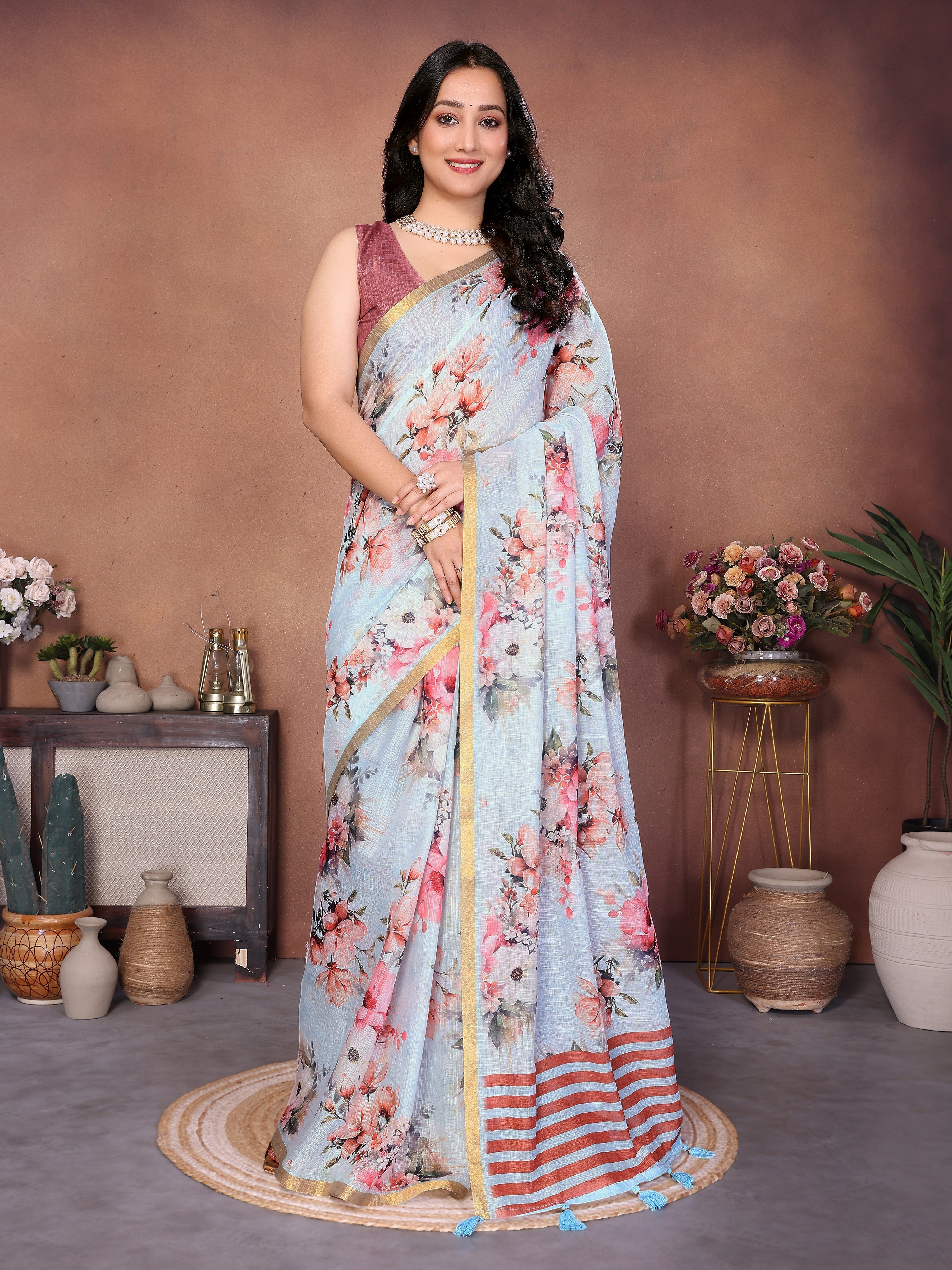 Powder blue floral ready-to-wear saree with striped pallu, tassels and side pocket
