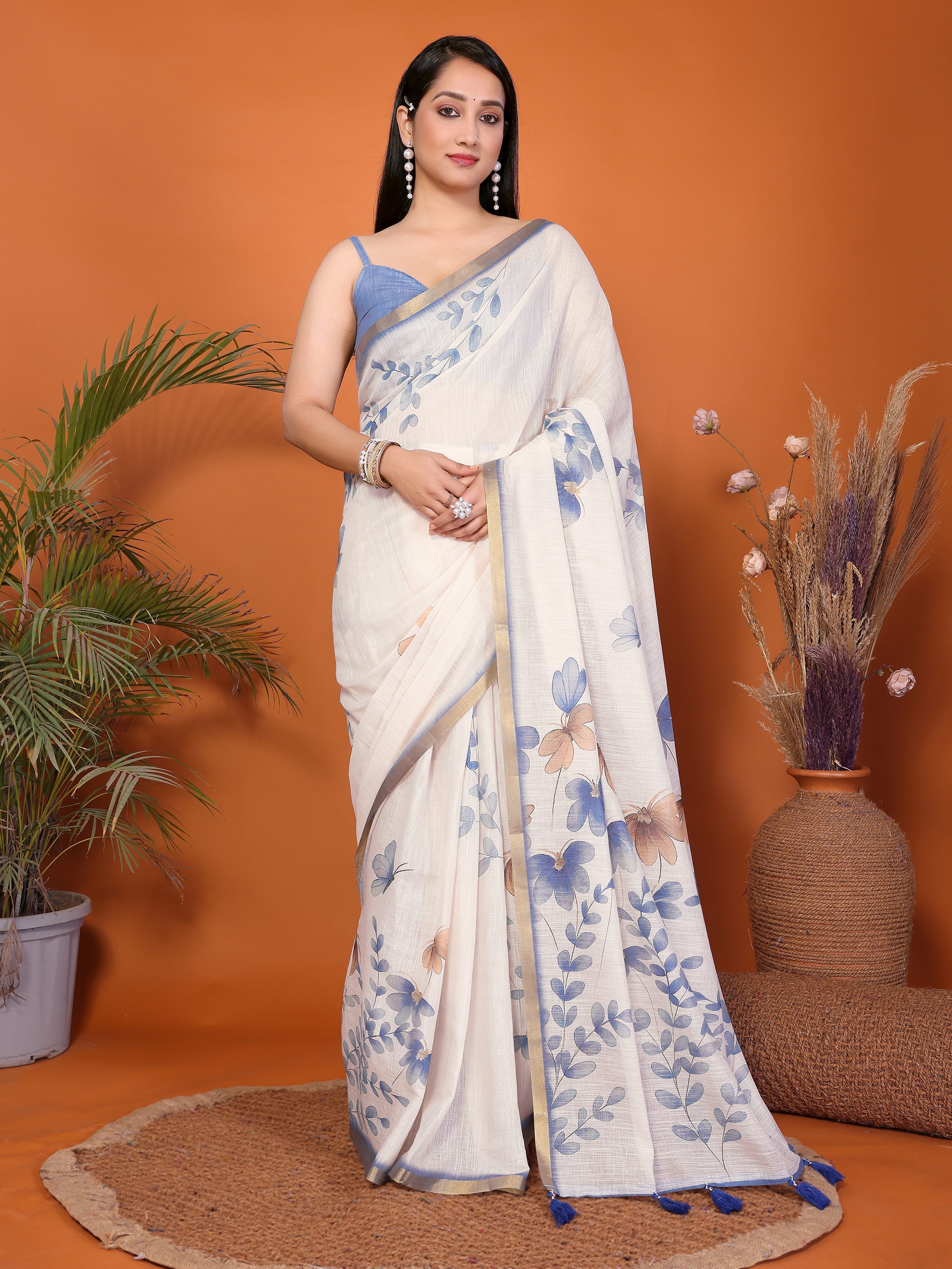 Cream white blue floral ready-to-wear saree with gold border, tassels and side pocket