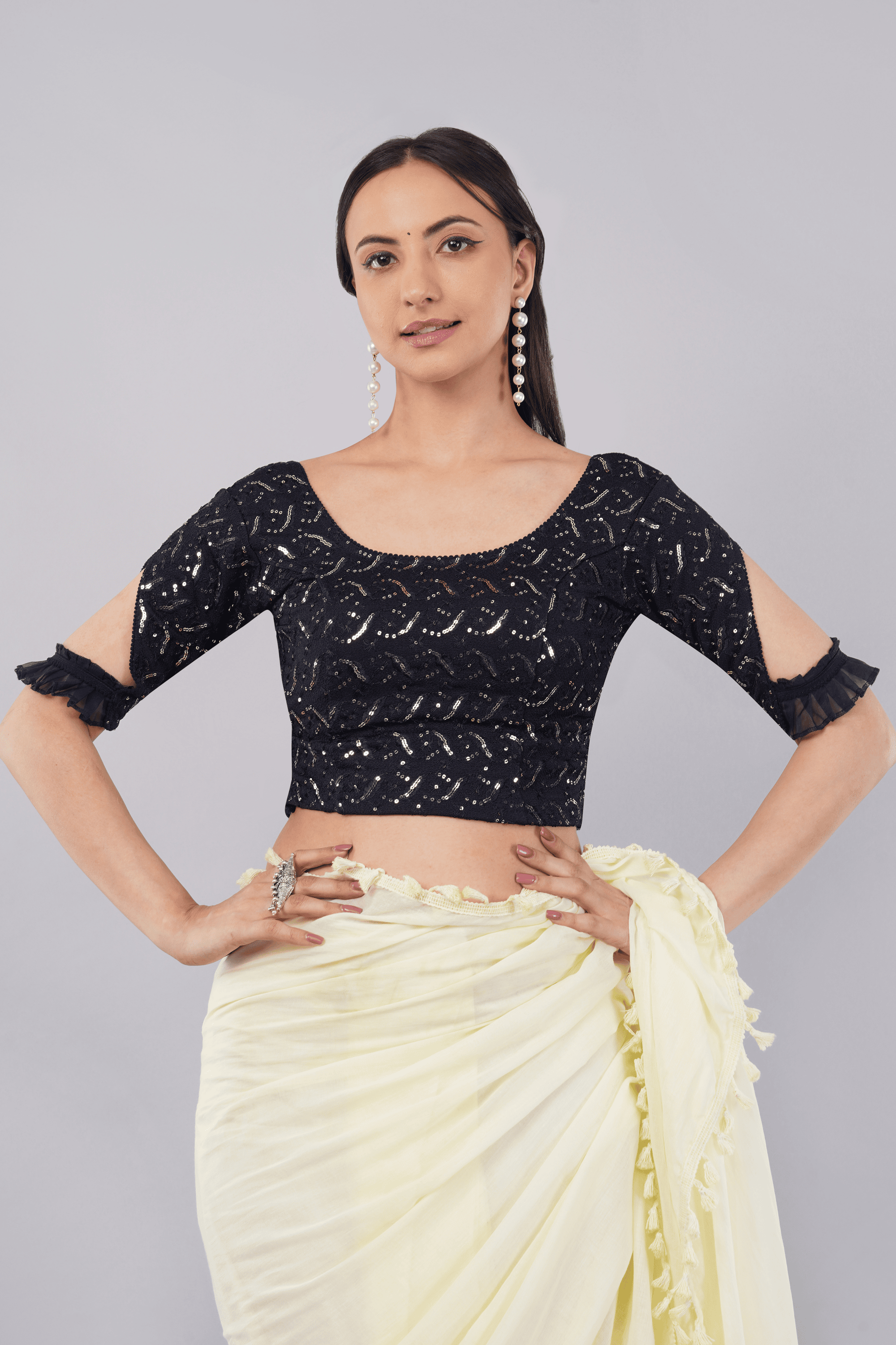 Dark blue sequin embroidered blouse with cut-out sleeves and ruffle detailing