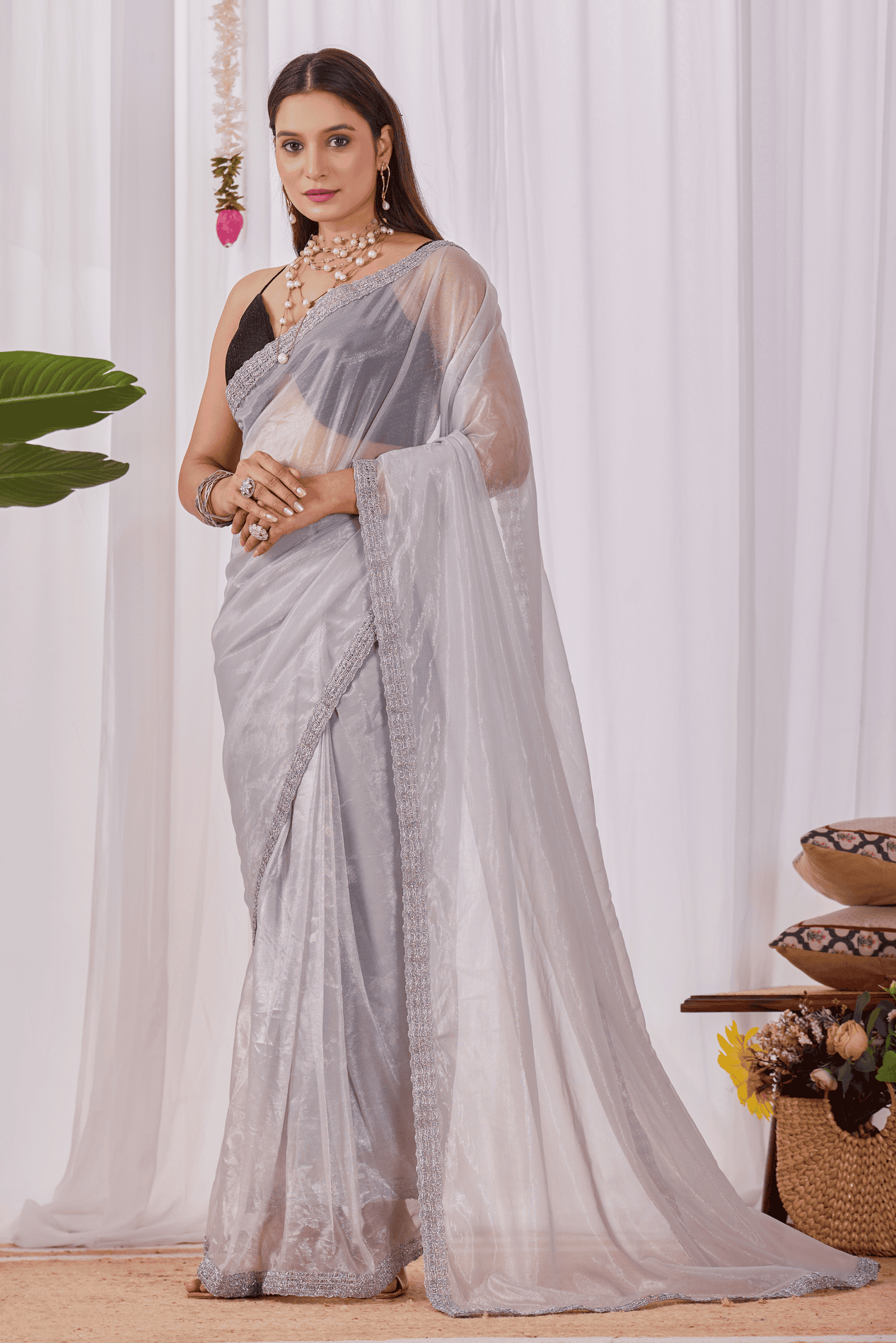 silver gold shimmer ready-to-wear saree with sequin border, waist belt, and contrast red sleeveless blouse