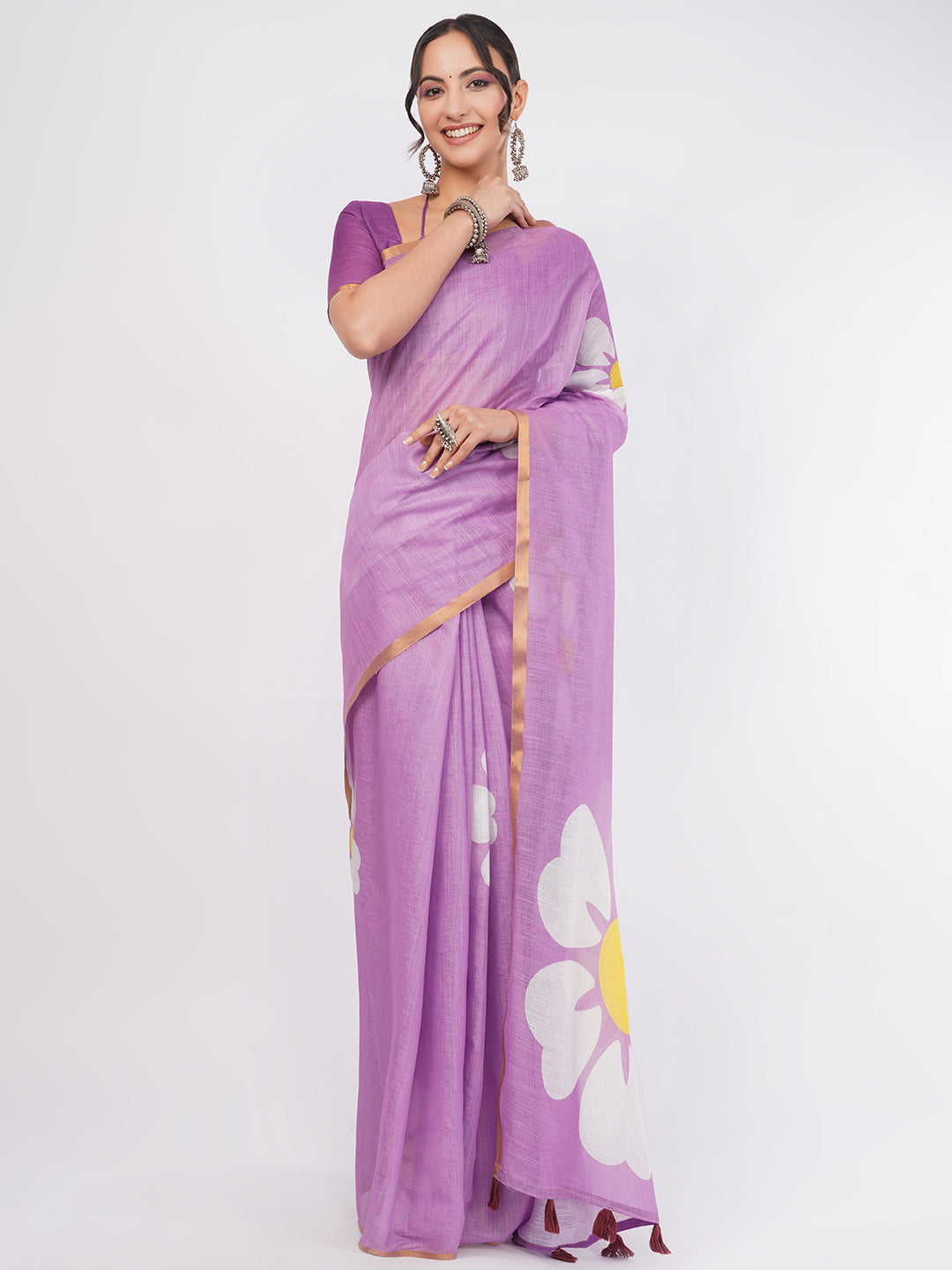 Lavender purple linen saree with giant white daisy prints draped by woman for summer day wear by Samantha