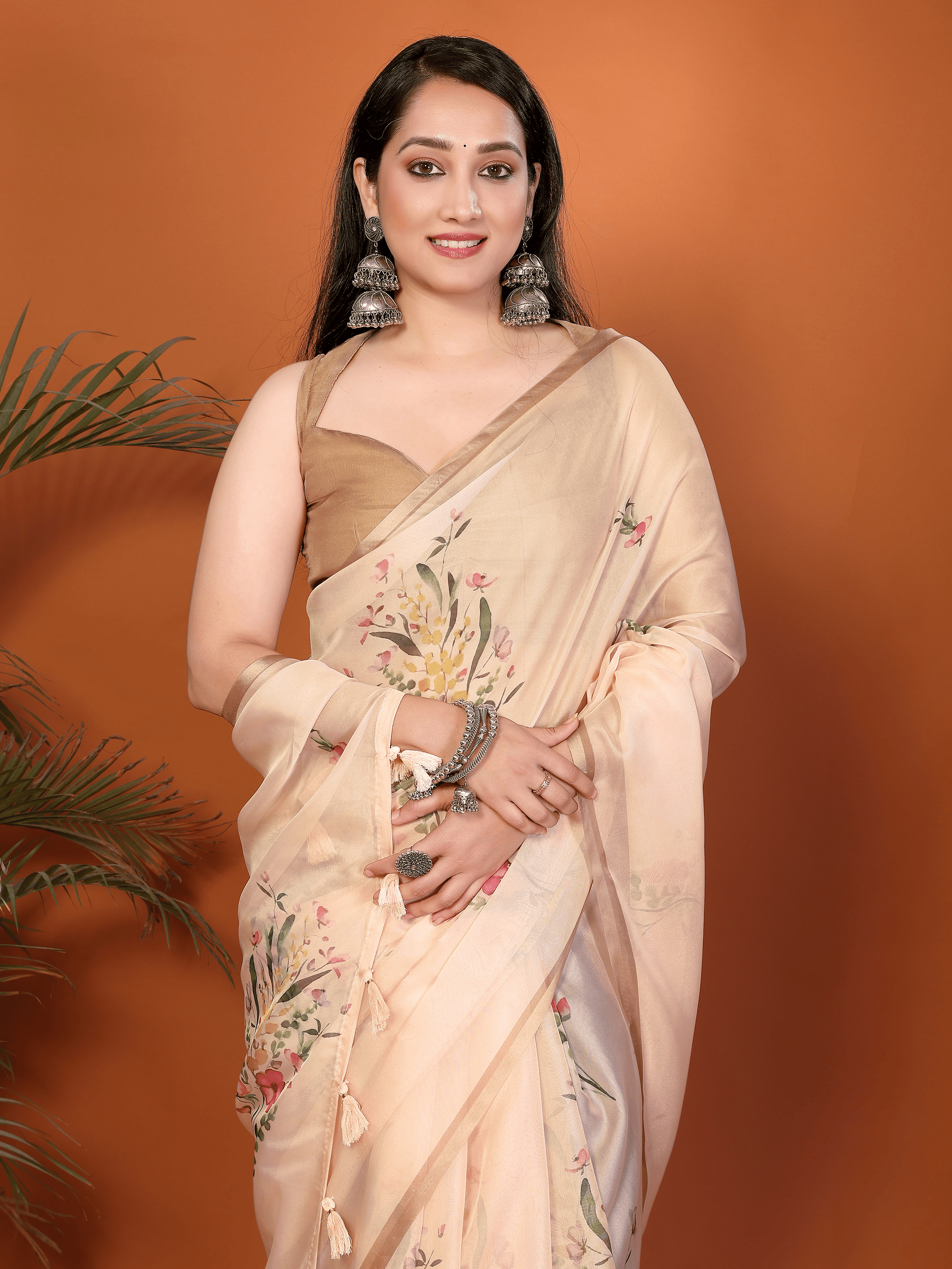 Sandalwood Peach Floral Print Saree with Metallic Border and Ruched Bronze Blouse