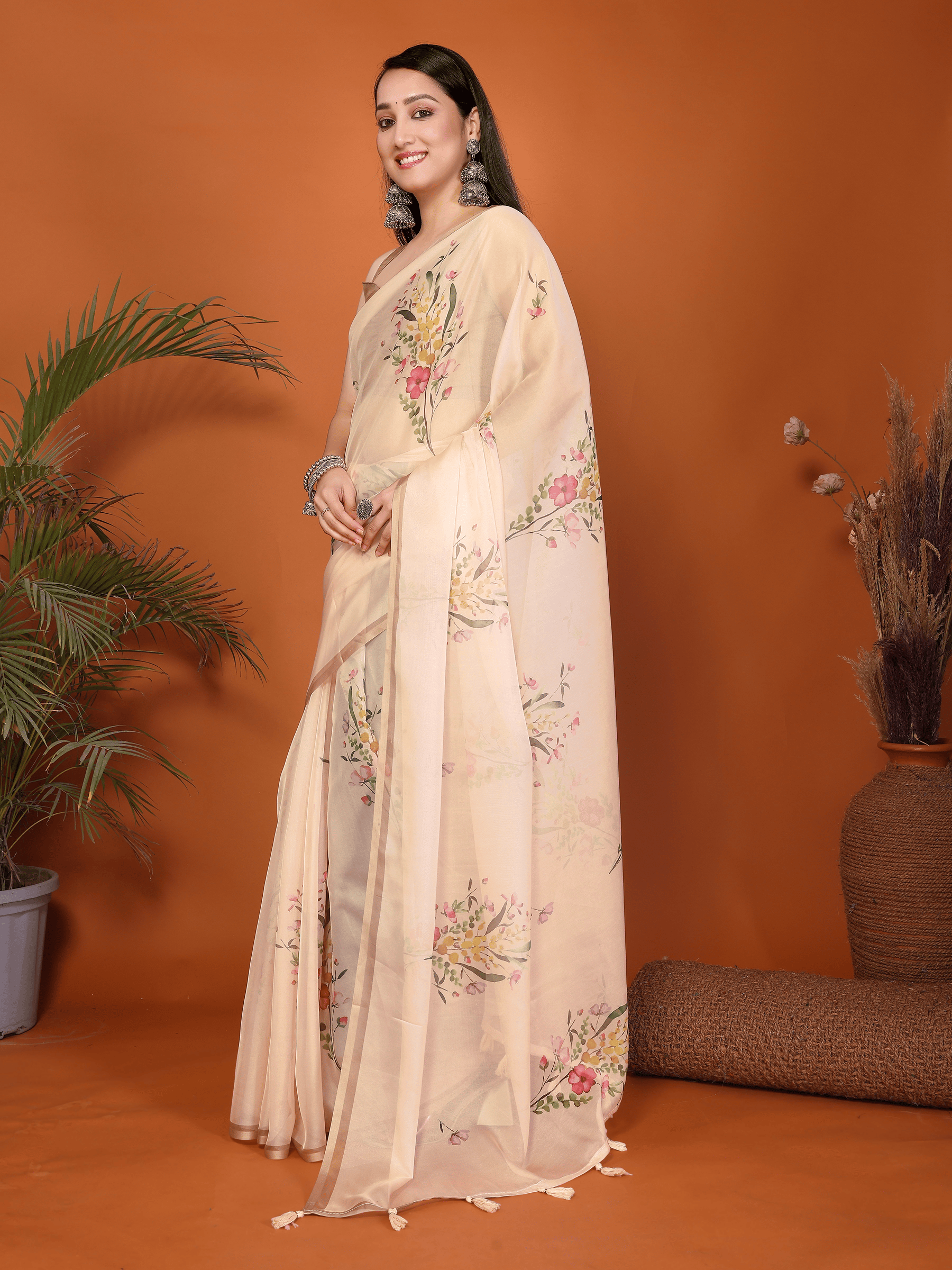 Sandalwood Peach Floral Print Saree with Metallic Border and Ruched Bronze Blouse