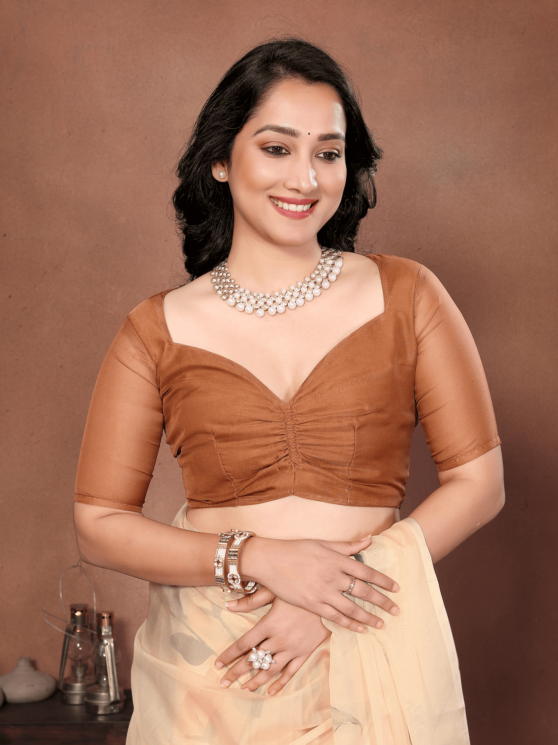 Cream Floral Print Saree with Orange Lily Motifs and Ruched Bronze Blouse