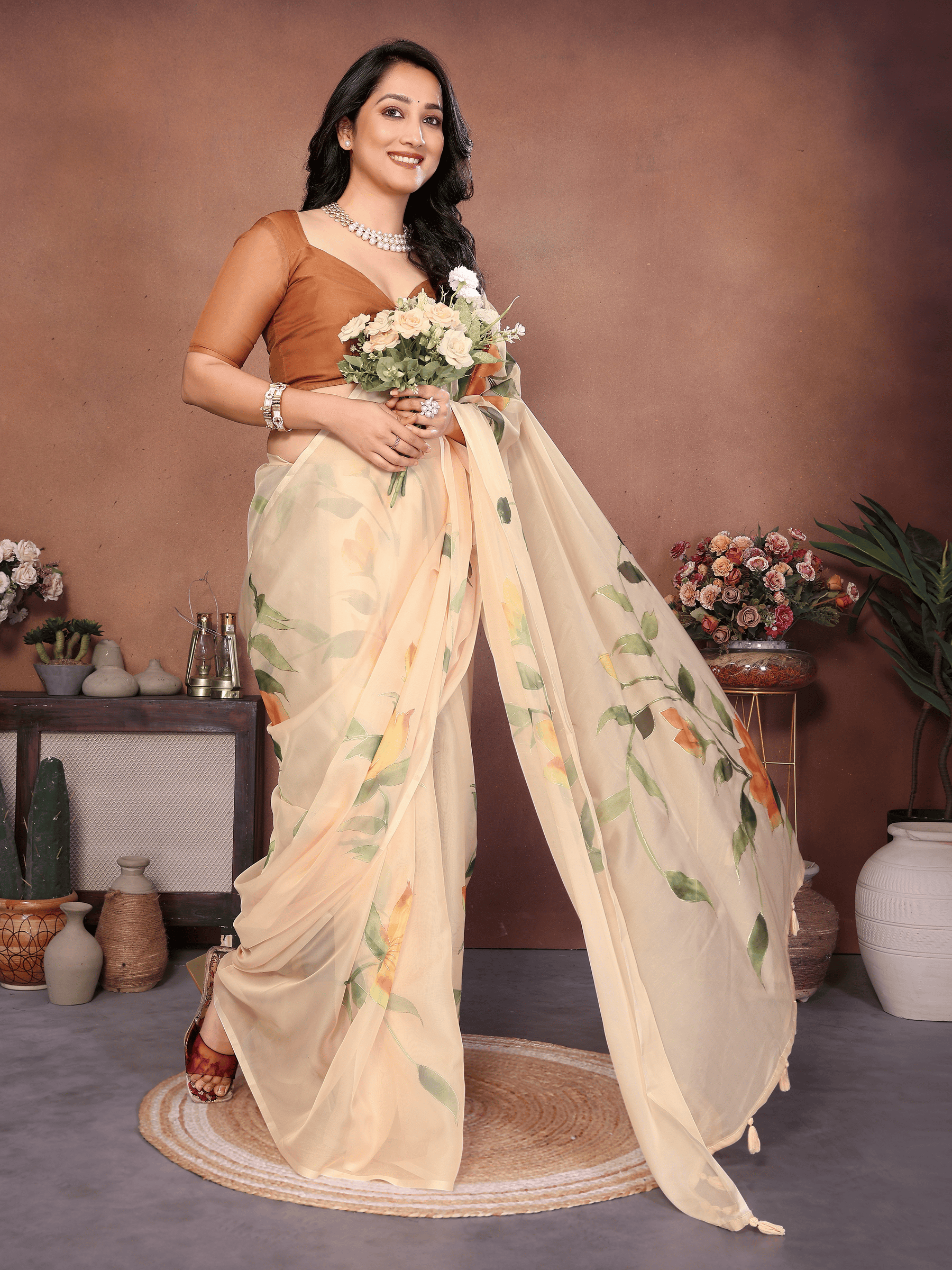 Cream Floral Print Saree with Orange Lily Motifs and Ruched Bronze Blouse